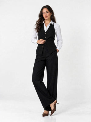 Noir Halter Vest - front, hand on silver buttons